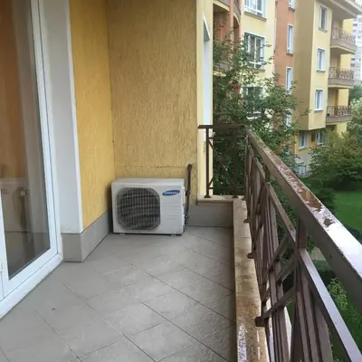 a air conditioner sitting on the balcony of a building at Alex Apartment Sofia in Sofia