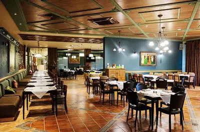 a restaurant with tables and chairs in a room at Hot Springs Medical and SPA in Banya