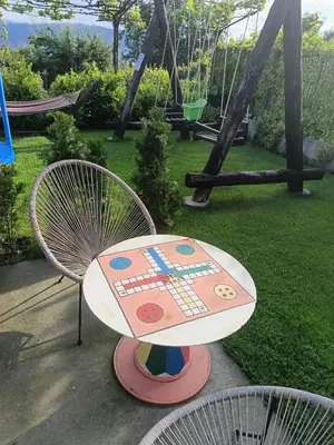 a table and two chairs in a playground at Къща за гости Мурите in Sapareva Banya