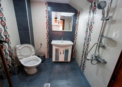 a small bathroom with a toilet and a sink at Kavdanski Guesthouse in Sapareva Banya