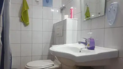 a bathroom with a sink and a toilet at Guest House - Batak in Batak