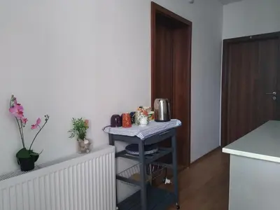 a small table in a room with a kitchen at Guest House - Batak in Batak