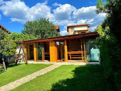 a house with glass doors on a yard at Guest House Vasilena Самостоятелно наемане FREE PARKING in Sapareva Banya