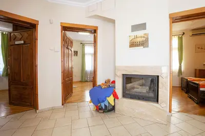 a living room with a fire place in a fireplace at Time Traveling Apartment Sofia City in Sofia