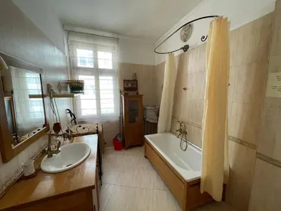 a bathroom with a tub and a sink and a bath tub at Time Traveling Apartment Sofia City in Sofia