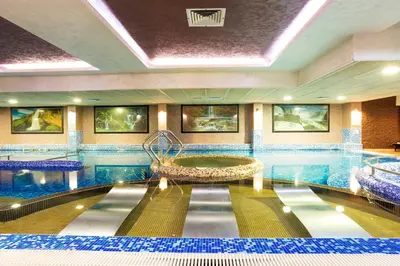 a pool in a hotel with a swimming pool at Balneo Complex & Spa Aquatonik in Velingrad