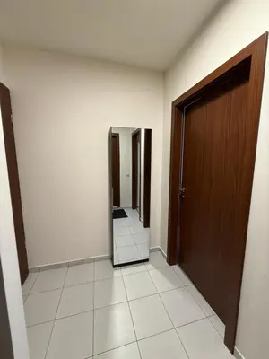 an empty hallway with a mirror and a door at PM Services Borovets Garden Apartments in Borovets