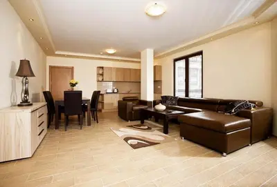 a living room with a couch and a table at Parklands Hotel & Pool in Bansko