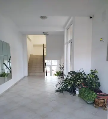 a hallway with plants and a staircase in a building at Ma-Bebe SPA Suite - Thermal Jacuzzi and Family Comfort in Pchelin
