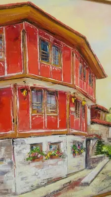 a painting of a red house with flowers in the windows at Guest House Maria in Koprivshtitsa