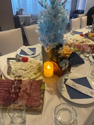 a table with plates of food on top of it at Hotel Consul in Sofia