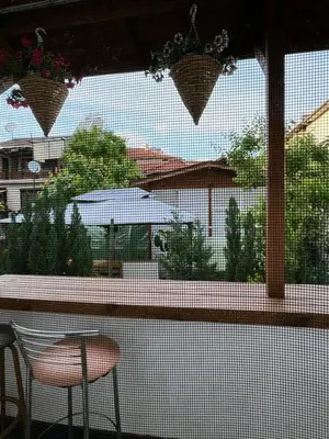 a view from a window of a patio with a table and chairs at Apartment Alex in Sandanski