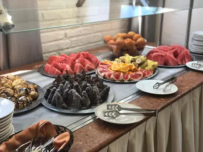a buffet of different types of food on a table at Flora Hotel - Apartments in Borovets