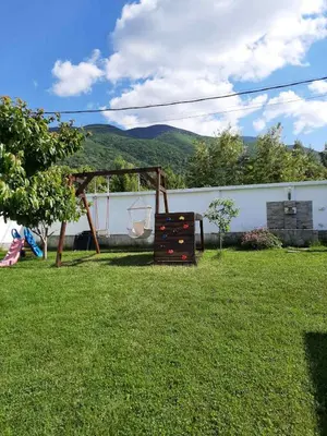 a backyard with a gazebo in the grass at Villa Gardenia in Sapareva Banya