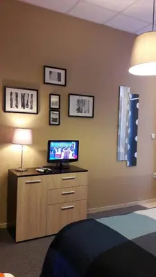 a room with a tv on top of a dresser at Studio M in Plovdiv