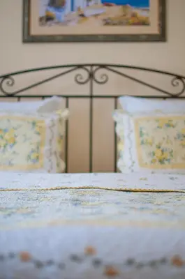 a close up of a bed with two pillows at Guest House Verbena in Apriltsi