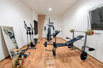 a gym with several exercise bikes in a room at Luxor Hotel in Smolyan