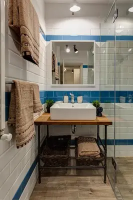 a bathroom with a sink and a mirror at Silver & Gold Apartment in Sofia