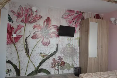 a room with a floral wallpaper on the wall at Guest Rooms Filipopol in Plovdiv