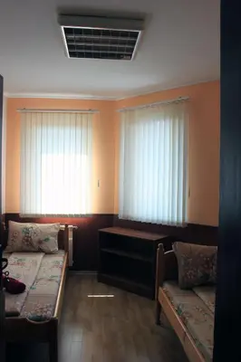 a room with two beds and two windows at Osogovo Rooms in Sofia
