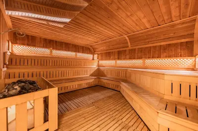 a large wooden sauna with wooden benches at Maxi Park Hotel & Spa in Velingrad