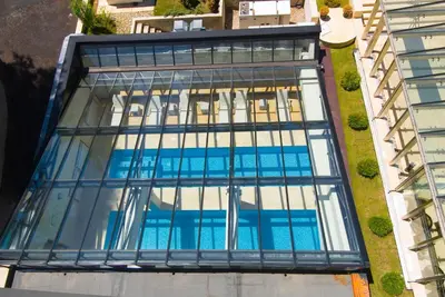 an overhead view of a building with glass windows at Radina's Way Hotel in Borovets