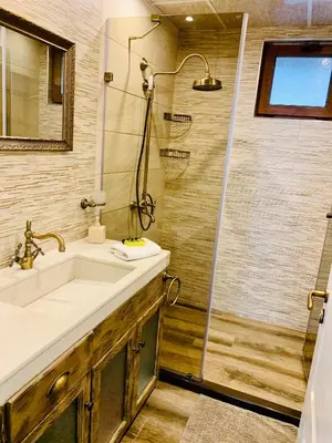 a bathroom with a sink and a shower at Guest House Holiday in Melnik in Melnik