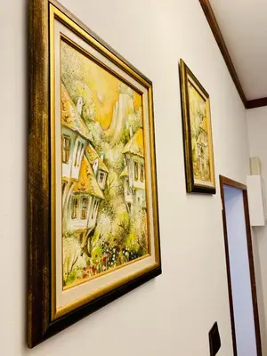 a painting hanging on a wall in a room at Guest House Holiday in Melnik in Melnik