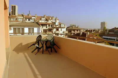 a table and chairs on the balcony of a building at Апарт Център Apart Center in Plovdiv