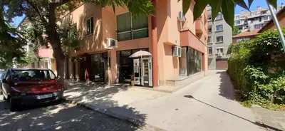 a small car parked on a street next to a building at Апарт Център Apart Center in Plovdiv