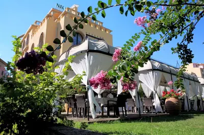 a group of chairs under a gazebo with flowers at Park Hotel Sandanski in Sandanski