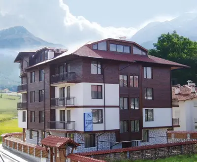 a rendering of a building with mountains in the background at Apartments & Studios Mountain Romance in Bansko