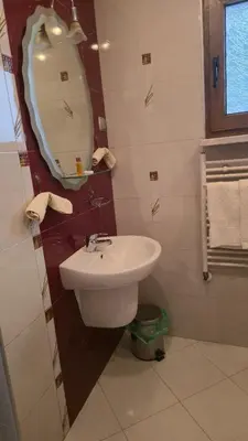 a bathroom with a sink and a mirror at Guest House Blisten in Sofia