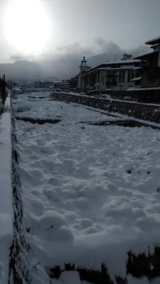 a body of water with snow on the ground at Pine Tree Apartment D34 in Bansko