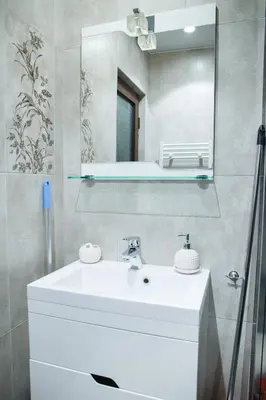 a bathroom with a white sink and a mirror at Apartment Ira in Velingrad