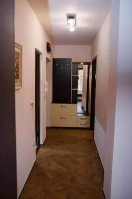 a hallway leading to a kitchen and a living room at Apartment Ira in Velingrad