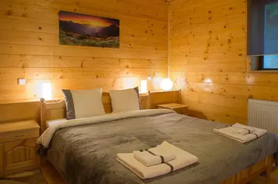 a bedroom with a bed with two towels on it at Sapareva Kashta in Sapareva Banya