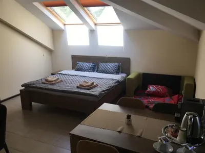 a small room with a bed and a couch at Sofia Family House - Free Parking in Sofia