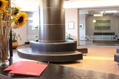 a spiral fountain in the middle of a lobby at Kendros Hotel in Plovdiv