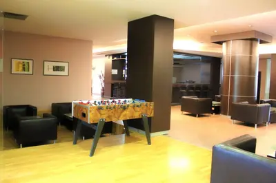 a room with a chess board in the middle of a room at Kendros Hotel in Plovdiv
