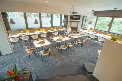 an overhead view of a restaurant with tables and chairs at Family Hotel EDI in Sofia