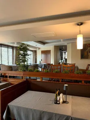 a dining room with a table with bottles on it at Family Hotel EDI in Sofia
