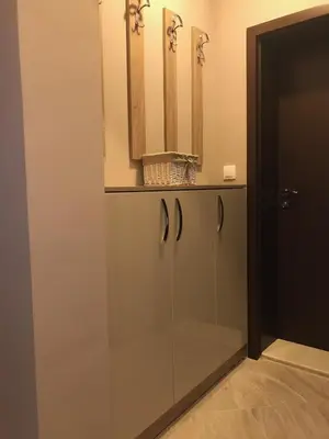 a glass cabinet with a mirror on top of it at Apartment Trimontium in Plovdiv