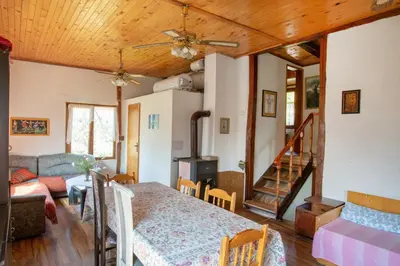 a living room with a table and a couch at Вила Бойковец in Boykovets