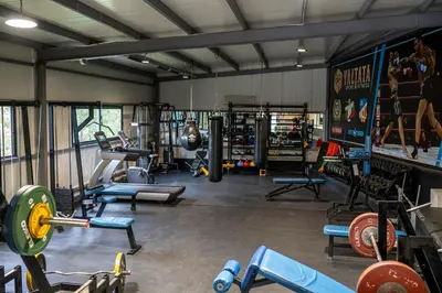 a gym with a lot of equipment in it at Комплекс язовир Валтата Komplex yazovir VALTATA in Samuilovo