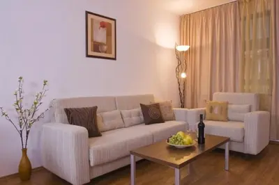 a living room with a couch and a table at Belvedere Holiday Club in Bansko