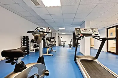 a gym with treadles and treadles in a room at Belvedere Holiday Club in Bansko