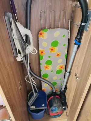 a room with a vacuum cleaner and a pillow at Guest Apartment Monarch in Smolyan