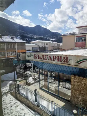a train station in a town with snow on the ground at Guest Apartment Monarch in Smolyan
