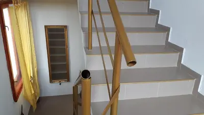 a set of baseball bats on a stair case at Guesthouse Jasmin in Sapareva Banya